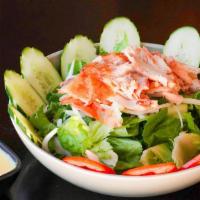 Thai Salad · Crisp lettuce, sliced cucumbers, tomatoes, onions, and chicken breast topped with creamy hou...