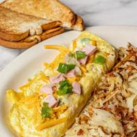 Denver Omelette · Ham, cheese, onions, and green peppers. With hash and choice of toast.