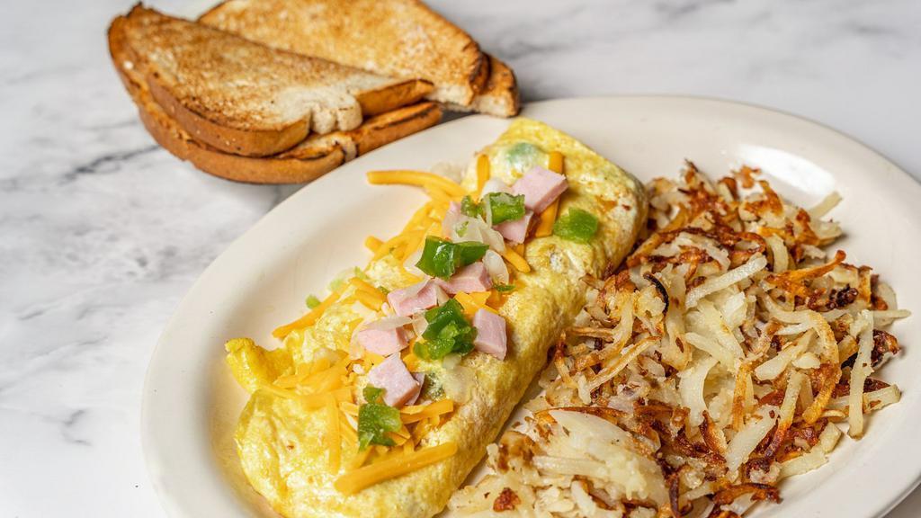 Denver Omelette · Ham, cheese, onions, and green peppers. With hash and choice of toast.