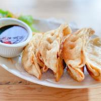 Pot Stickers (7) · 7 pieces. Fried pork potstickers. Served with sweet and sour sauce.
