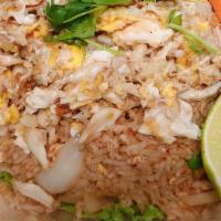 Crab Fried Rice · Crabmeat fried rice with egg, onion, and mixed vegetables.