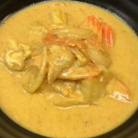 Thai Yellow Curry · Spicy. Yellow curry powder and curry paste in coconut milk, potatoes, carrots and onions.