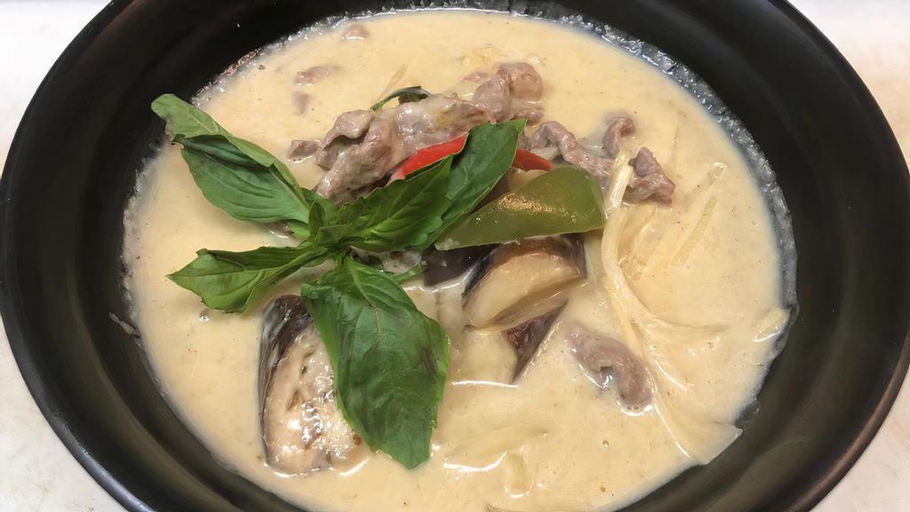 Thai Green Curry · Spicy. Thai green curry paste in coconut milk, bamboo shoots, eggplants, bell peppers and basil.