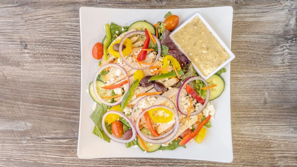 Greek Salad · Mixed greens, gyro meat, feta cheese, cucumbers, tomato, carrots, kalamata olives, bell peppers, pepperoncini, red onions and Greek feta dressing.