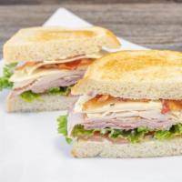 City Club Classic · Turkey, ham and bacon, American cheese, lettuce, tomato and mayo on toasted sourdough or pla...