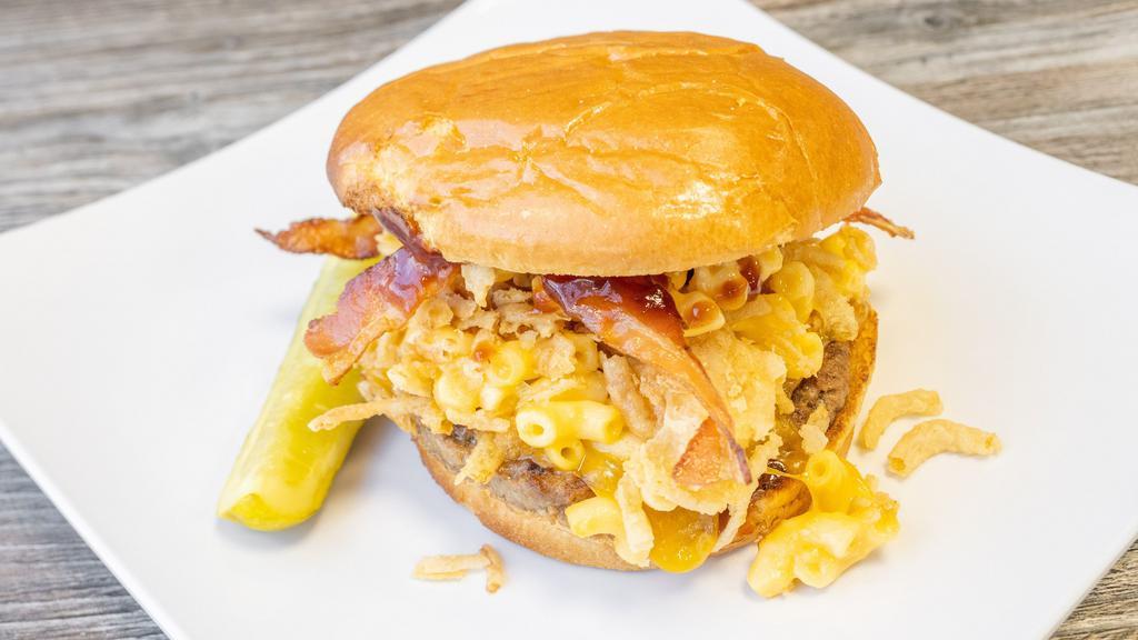 Mac 'N Cheese Burger · 1/3 lb. angus, mac and cheese, bacon, French fried onions, melted cheddar cheese, sweet baby ray's sauce and pickle spear.