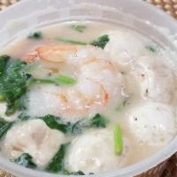 Tom Ka · Hot and sour coconut soup with galanga, lemongrass, lime juice, mushroom and cilantro.
