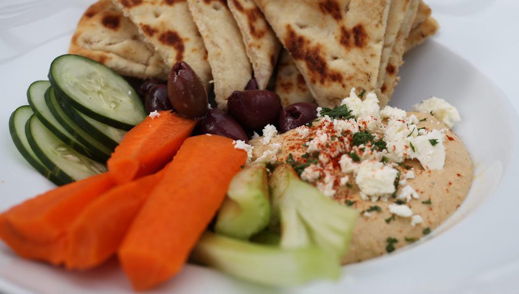 Hummus Plate · Fresh toasted pita w/ roasted bell peppers, pickled onions, kalamata olives, feta cheese,
fresh celery, tomatoes, cucumbers, and carrots.