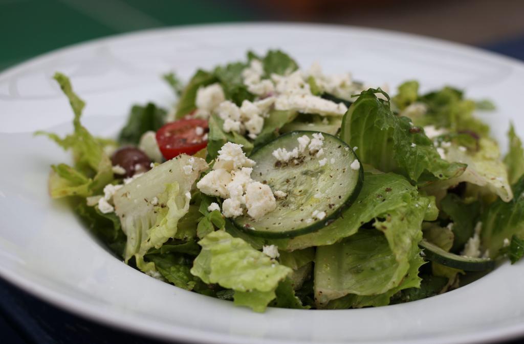 Greek Salad · Fresh romaine, cherry tomatoes, red onions, kalamata olives, diced cucumbers, topped with
feta cheese and Italian dressing.