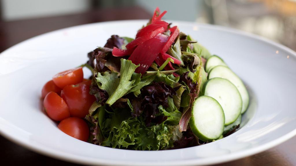 Gol Salad · Fresh greens, diced tomatoes, pickled onions, sliced cucumbers, w/ Dijon vinaigrette.