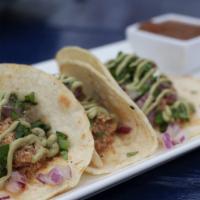 Tacos De La Casa · Three fresh corn tortillas with choice of steak, chicken, pork or veggie, topped with diced
...