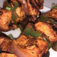 Chili Chicken · Fried battered chicken bites sauteed with bell pepper and onions