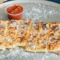 Cheesy Breadsticks · Our Made-From-Scratch Dough packed with mozzarella. Served with a side of marinara for dipping