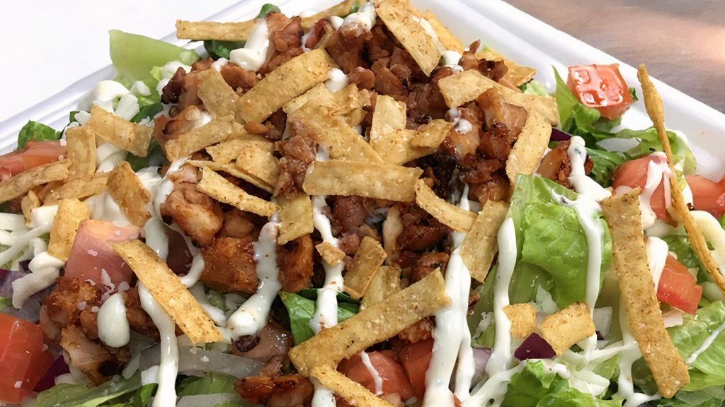 Bbq Chicken Salad · 4 oz of diced chicken marinated in BBQ sauce. Served on a bed of romaine lettuce with Fresh Tomato, Onion, Mozzarella and Tortilla Strips