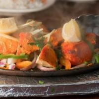 Chicken Tikka Masala · Most popular. Sliced, tandoor-baked boneless breast of chicken simmered in our signature tom...