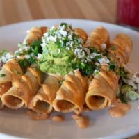 Taquitos · Five crispy rolled tacos stuffed with shredded chicken, topped with guacamole, cilantro, que...
