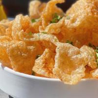 Chicharrones · Crispy pork rinds dusted with chile-lime seasoning. Choice of salsa.