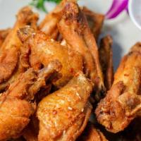 椒盐鸡翅 / Salt & Pepper Chicken Wings · House marinate, lightly fried sautéed with salt & pepper seasoning.