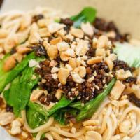 四川担担面 / Dan Dan Noodles · Minced pork, ground peanuts, simple greens, & spicy sesame dressing.