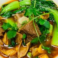 川味牛肉面 / Sichuan Beef Noodle Soup · Braised beef, baby bok choy, thin soft noodles in a spicy bone broth