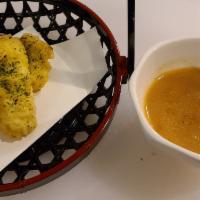 Corn Tempura · 4 pieces of tempura fried corn kernels served with garlic butter/soy sauce.