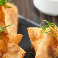 Crispy Crab Wontons · Served with a sweet chili dipping sauce
