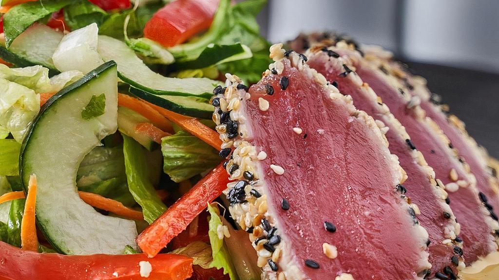 Ahi Salad · sesame-seared ahi, mixed greens, red bell peppers, pickled ginger, cilantro, miso-ginger vinaigrette