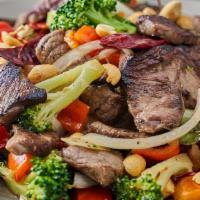 Kung Pao Beef · sliced flat iron steak, dried chilies, onions, red bell peppers, broccoli, peanuts, chili-soy