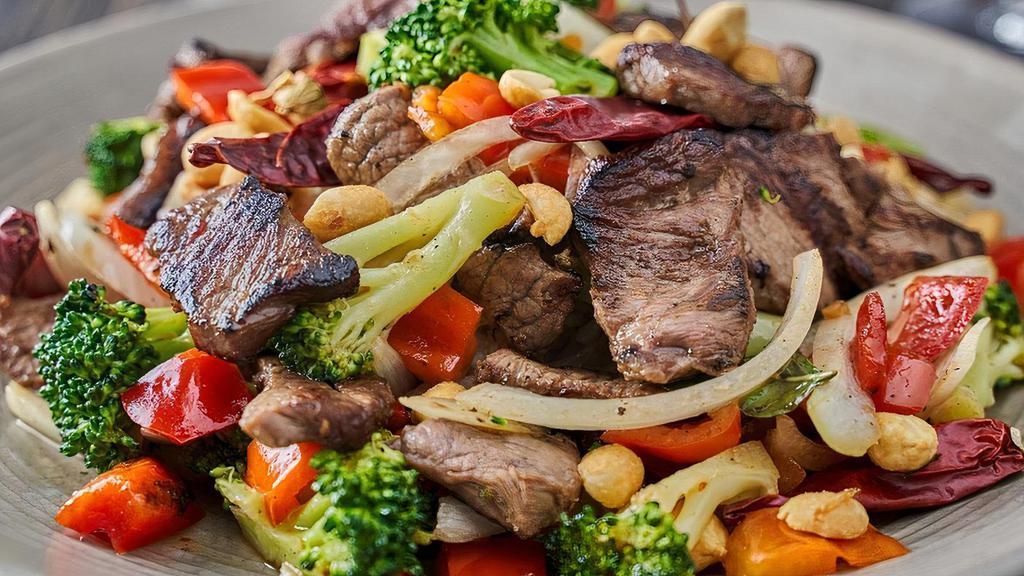 Kung Pao Beef · sliced flat iron steak, dried chilies, onions, red bell peppers, broccoli, peanuts, chili-soy