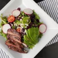Steak Salad · Salad greens , cherry tomatoes, radishes, avocado, dried cranberries, bleu cheese and grille...
