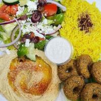 Combo Appetizer · Served with our fresh made hummus, baba ganoush, three pieces of our fresh made falafel, thr...