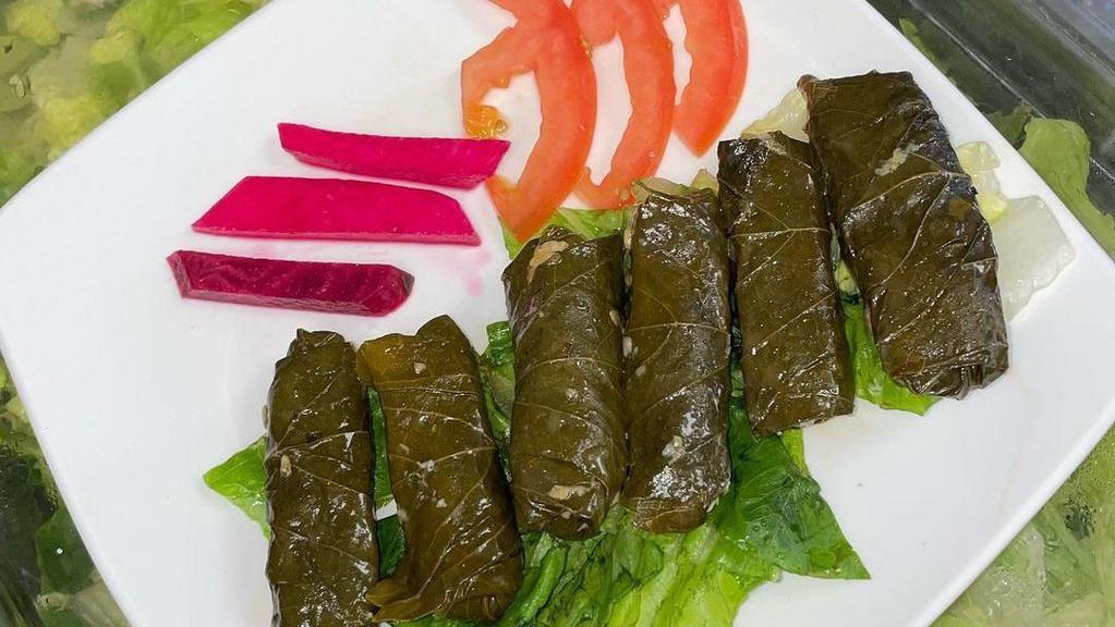 Stuffed Grape Leaves (6 Pieces) · Fresh grape leaves stuffed with seasoned and steamed rice. Served cold.