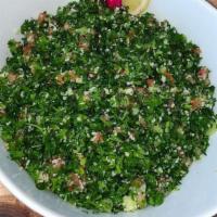 Tabouleh Salad · Served with diced tomatoes, onions, parsley, mint, and tossed wheat bulgur.