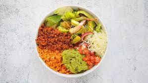 Carnitas Burrito Bowl · Carnitas, spanish rice, black beans, pico de gallo, and shredded cheese over romaine lettuce.