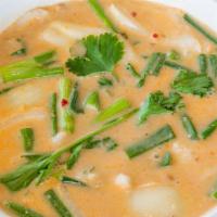 Tom-Kha Soup (Coconut) · Lemony coconut soup with onion, mushroom, tomato, lemon grass, galangal and lime leaves