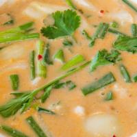 Tom-Kha Soup · Lemony coconut soup with onion, mushroom, tomato, lemon grass, galangal and lime leaves with...