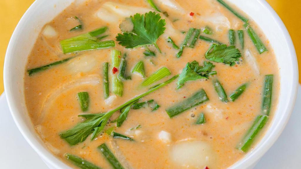 Tom-Kha Soup · Lemony coconut soup with onion, mushroom, tomato, lemon grass, galangal and lime leaves with coconut Soup with Shrimp/ Sea-Food or Fish