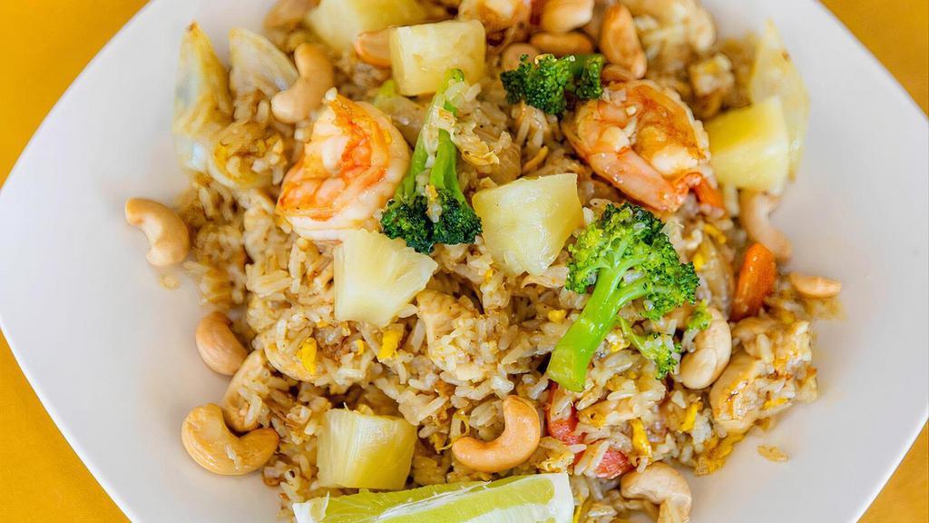 Pineapple Fried Rice · Jasmin rice with egg, pineapple, snow-peas, onion, carrot, broccoli, cashew with yellow curry powder