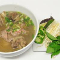 Oxtail Pho · Homestyle Vietnamese noodle soup. Served with fresh bean sprouts, lime, jalapeño, basil and ...