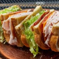 Clubhouse Sandwich (Whole) · Turkey, bacon, Cheddar, Swiss, lettuce and tomato.