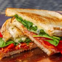 The Italiano Panini (Whole) · Salami, spicy pepperoni, provolone cheese, roasted red peppers, creamy pesto, mayo and baby ...
