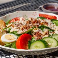 Baby Leaf Spinach Salad · With bacon, tomato, egg, shredded almonds, Parmesan cheese.