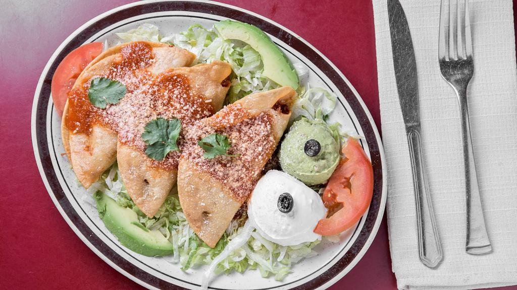 3 Chicken Taquitos · Deep-fried corn tortilla filled with fresh tasty chicken or picadillo on a bed of lettuce and garnished with sour cream and guacamole quesadillas.