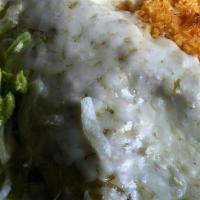 Burrito Verde · Chunks of pork in a light verde tomatillo sauce green peppers, onions and spices, all in a f...