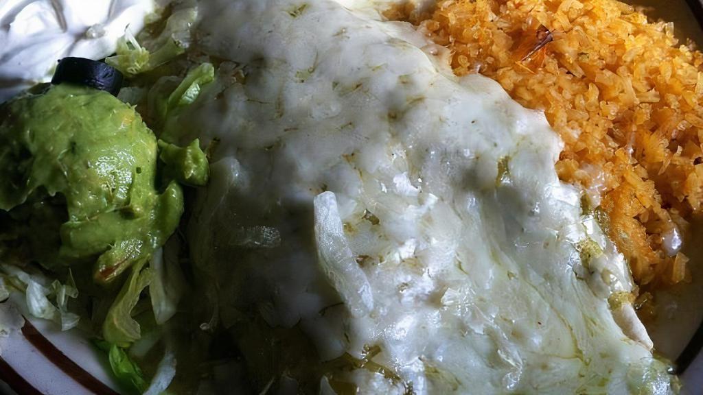 Burrito Verde · Chunks of pork in a light verde tomatillo sauce green peppers, onions and spices, all in a flour tortilla.
