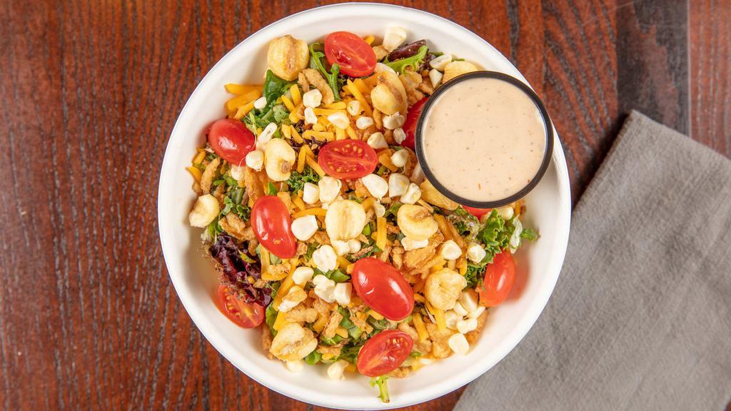 Kansas City Bbq · Mixed greens, cherry tomatoes, giant baked corn, fresh corn off the Cobb, shredded cheddar cheese, baked, onions string, cilantro, green onions and our house made BBQ ranch dressing.