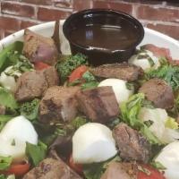 Tossed Caprese · Mixed greens, cherry tomatoes, fresh small mozzarella cheese balls, shredded basil and our h...