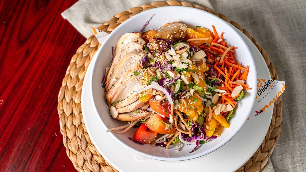 Asian Chicken Salad · Grilled chicken, sprouts, red cabbage, carrots, lettuce, tomatoes, mandarin oranges, Asian noodles, and sesame seeds with our low cal Asian dressing.