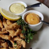 Adriatica · citrus-ginger marinated calamari steak strips served with lemon and spicy aioli dipping sauces