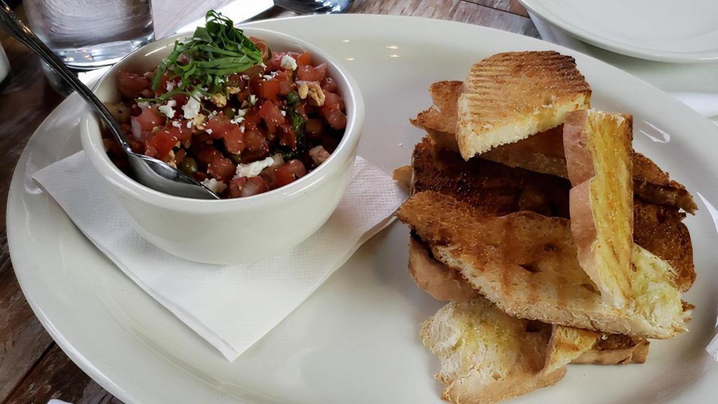 Bruschetta · bread from the grill drizzled with olive oil and served with Mediterranean tomato-caper salsa